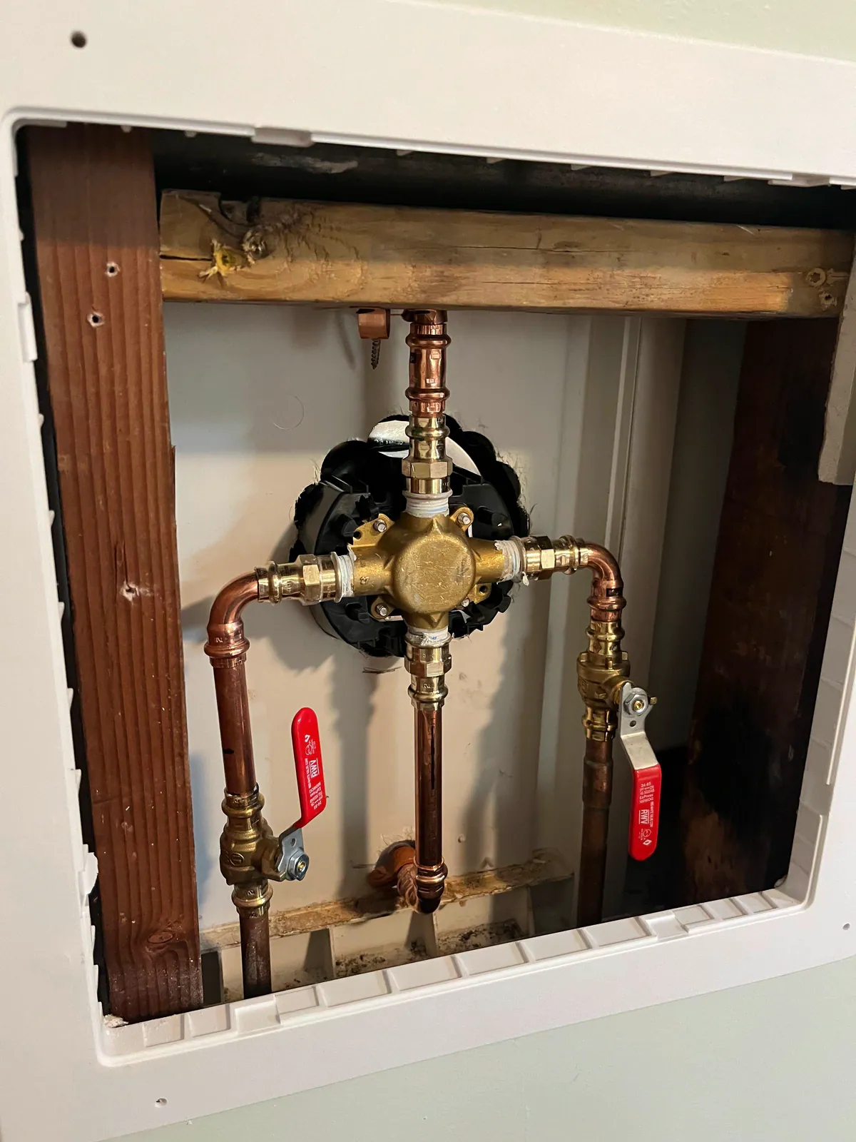 Copper valve and press-fitting assembly inside an open wall